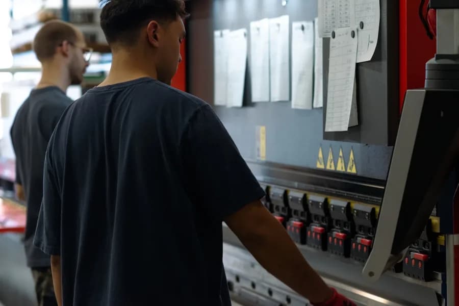 Production floor workers operating equipment